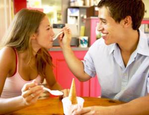 couple feeding yogurt