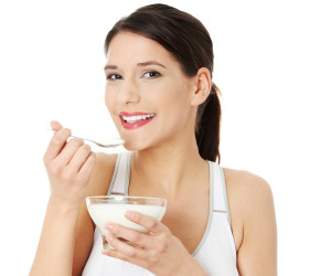 woman eating yogurt